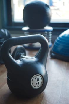 2 kg kettlebell on padded floor at gym.