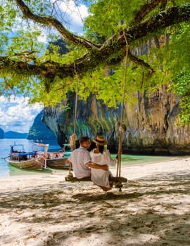 Couple on a boat trip to the Tropical lagoon of Koh Loa Lading Krabi Thailand part of the Koh Hong Islands in Thailand.
