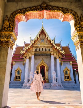 Wat Benchamabophit temple in Bangkok Thailand, The Marble temple in Bangkok. Asian woman with hat visiting temple in Bangkok