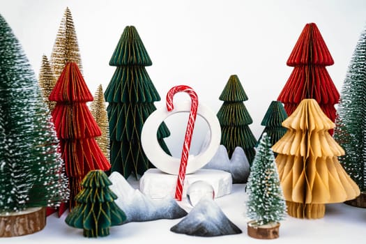 Christmas background with decorative Christmas trees. Candy stick. Advertising concept. High quality photo