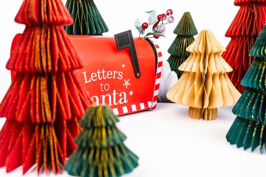 New Year's background for a product or card. Colored Christmas trees, Santa Claus mailbox. High quality photo