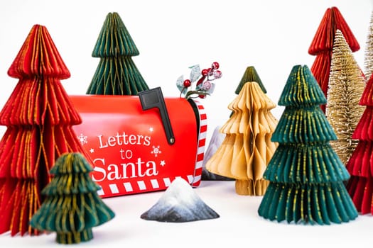 New Year's background for a product or card. Colored Christmas trees, Santa Claus mailbox. High quality photo