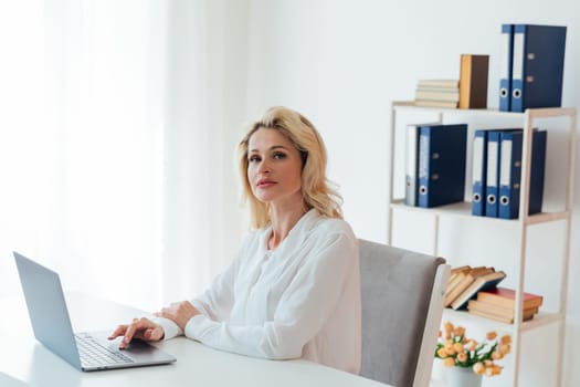 woman at computer in office at work