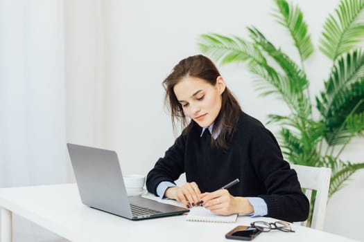 Smiling caucasian young businesswoman bank employee worker manager boss ceo looking at camera, using laptop for distant education work, e-learning, watching webinars online isolated in white