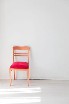 red old vintage chair in white room interior