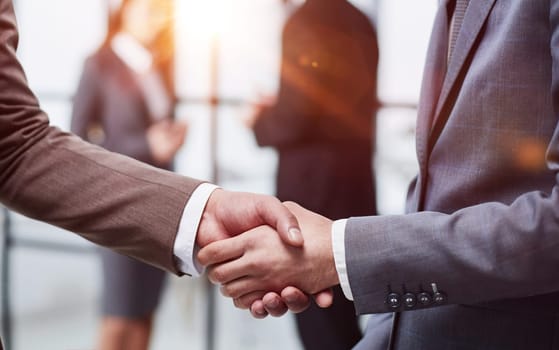 Nice to meet you. Close-up of two young businessmen shaking hands