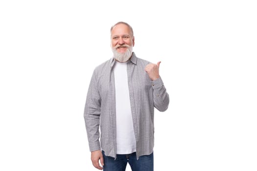 cute smart grandfather with a white beard and mustache dressed in a striped shirt over a t-shirt thought on a white background with copy space.