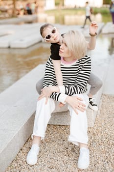 Mother hugging with her daughter outdoor in nature