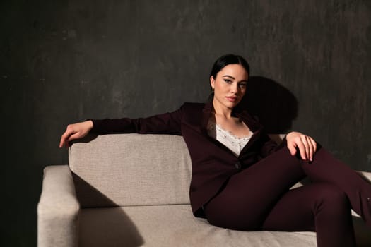 Business woman in brown business suit in office