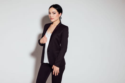 Business woman in brown business suit in office