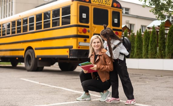 mother and little girl go to school.