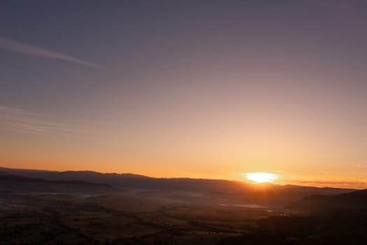 aerial view of foggy morning autumn mountains with clouds bansko bulgaria.