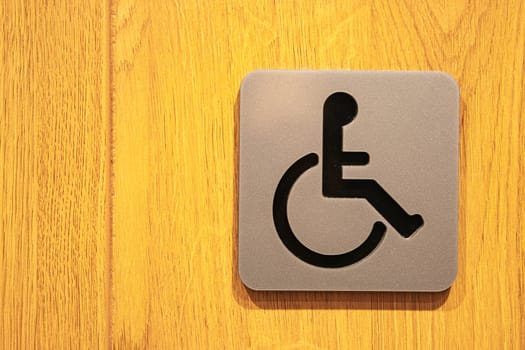 Image of a stainless steel sign for people with disabilities. Care and technology. Buttons for people with disabilities. High quality photo