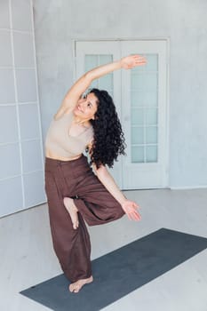 Female yogi doing asana pose exercises