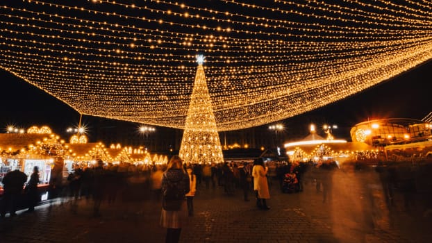 People in front of Christmas tree at Bucharest Christmas Market