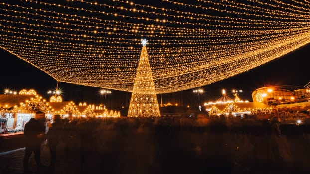 People in front of Christmas tree at Bucharest Christmas Market