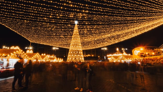 People in front of Christmas tree at Bucharest Christmas Market