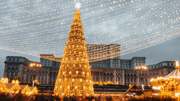 People in front of Christmas tree at Bucharest Christmas Market