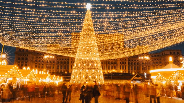 People in front of Christmas tree at Bucharest Christmas Market