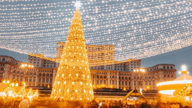 People in front of Christmas tree at Bucharest Christmas Market