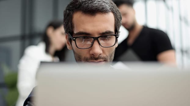 Young man working in a modern office