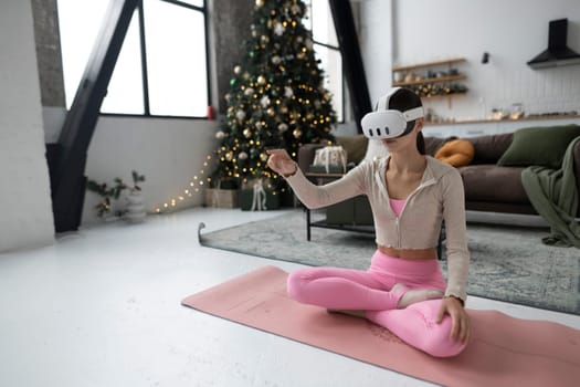 During the festive season, a trendy young woman is seen in a virtual reality headset. High quality photo