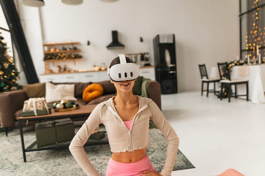 Wearing a virtual reality headset, a young and attractive lady speaks about her experiences. High quality photo