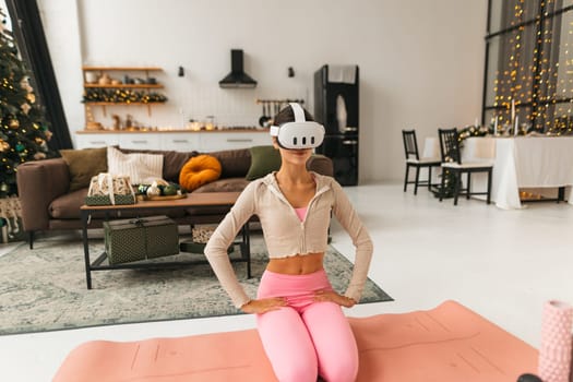 In a virtual reality headset, a young and stunning woman discusses her sensations. High quality photo