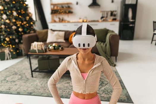 A young, beautiful woman shares her thoughts and feelings while wearing a virtual reality headset. High quality photo