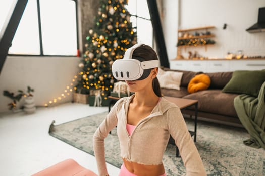 The young and gorgeous lady talks about her emotions within a virtual reality headset. High quality photo