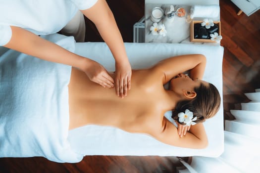 Panorama top view woman customer enjoying relaxing anti-stress spa massage and pampering with beauty skin recreation leisure in day light ambient salon spa at luxury resort or hotel. Quiescent