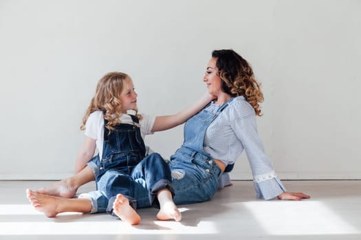 Family mom with daughter in denim clothes