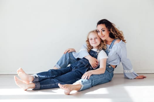 Family mom with daughter in denim clothes