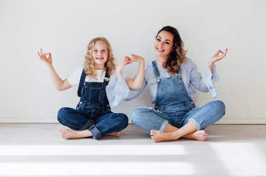 Family mom with daughter in denim clothes