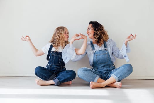 Family mom with daughter in denim clothes