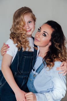 Family mom with daughter in denim clothes