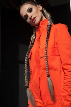 portrait of a woman in working orange clothes