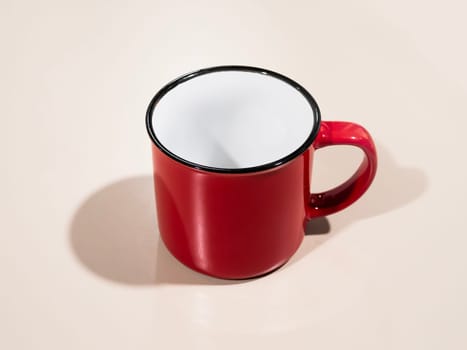 red enamel coffee cup isolated with shadow