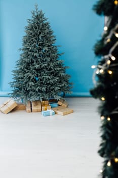 Decor Christmas blue Christmas tree with gifts and garlands interior