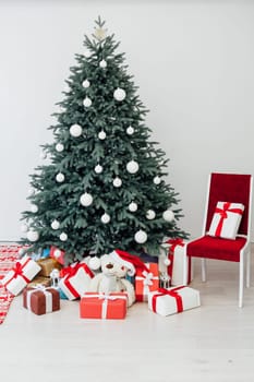 New Year's Christmas Tree with gifts and decor garlands