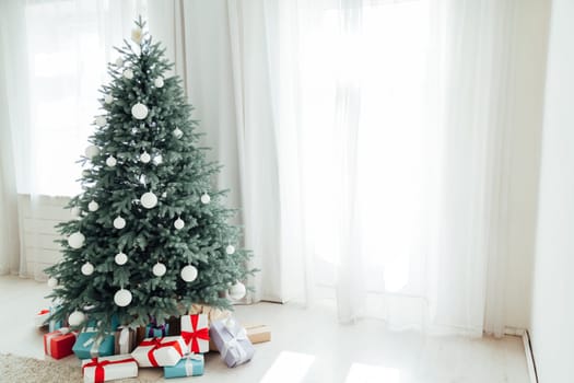 New Year's decoration Christmas tree with gifts and interior