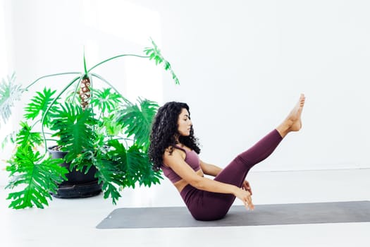 brunette woman engaged in yoga sports fitness asana body flexibility