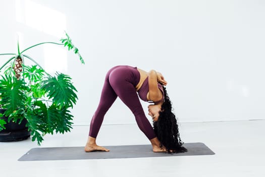 brunette woman engaged in yoga sports fitness asana body flexibility