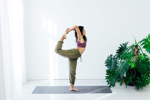 Beautiful female brunette yoga fitness sports body flexibility