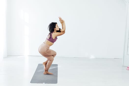 Beautiful female brunette yoga fitness sports body flexibility