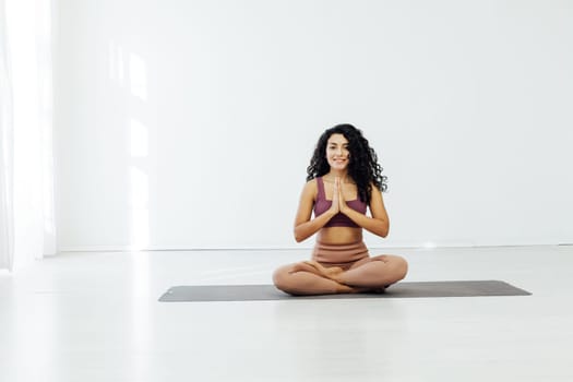 Beautiful brunette woman engaged in yoga asana flexibility body