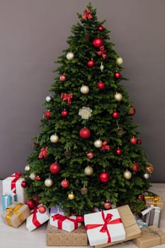 Christmas tree with presents underneath in living room