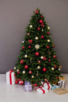 Christmas tree with presents underneath in living room