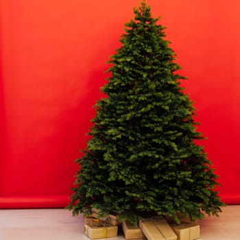 Beautiful holdiay decorated room with Christmas tree with presents