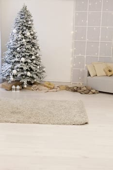 Home interior. A room with a beautiful snowy Christmas tree